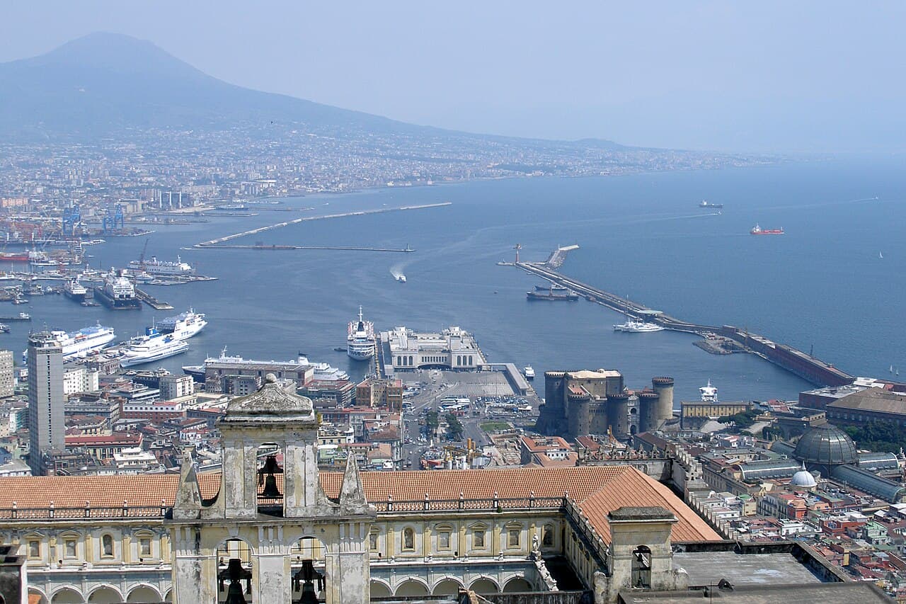 An elevated view over the Bay of Naples, the port and Mount Vesuvius across the water