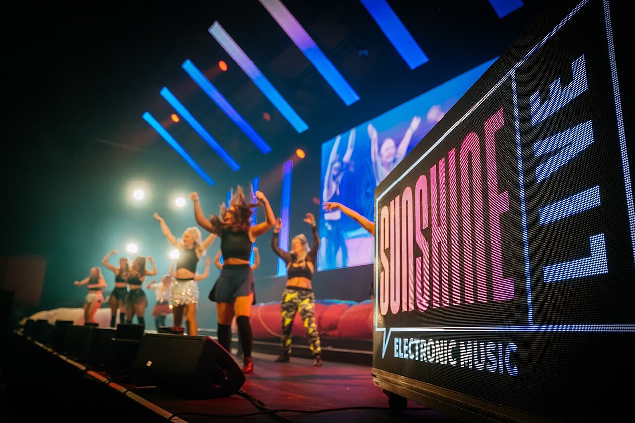 A large concert inside the Maimarkthalle exhibition hall in Mannheim — the indoor home of Time Warp