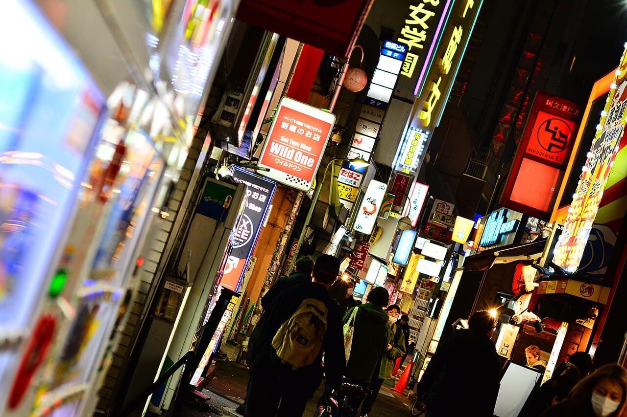 A neon-signed side street in Dōgenzaka, Shibuya — the heart of Tokyo's club district