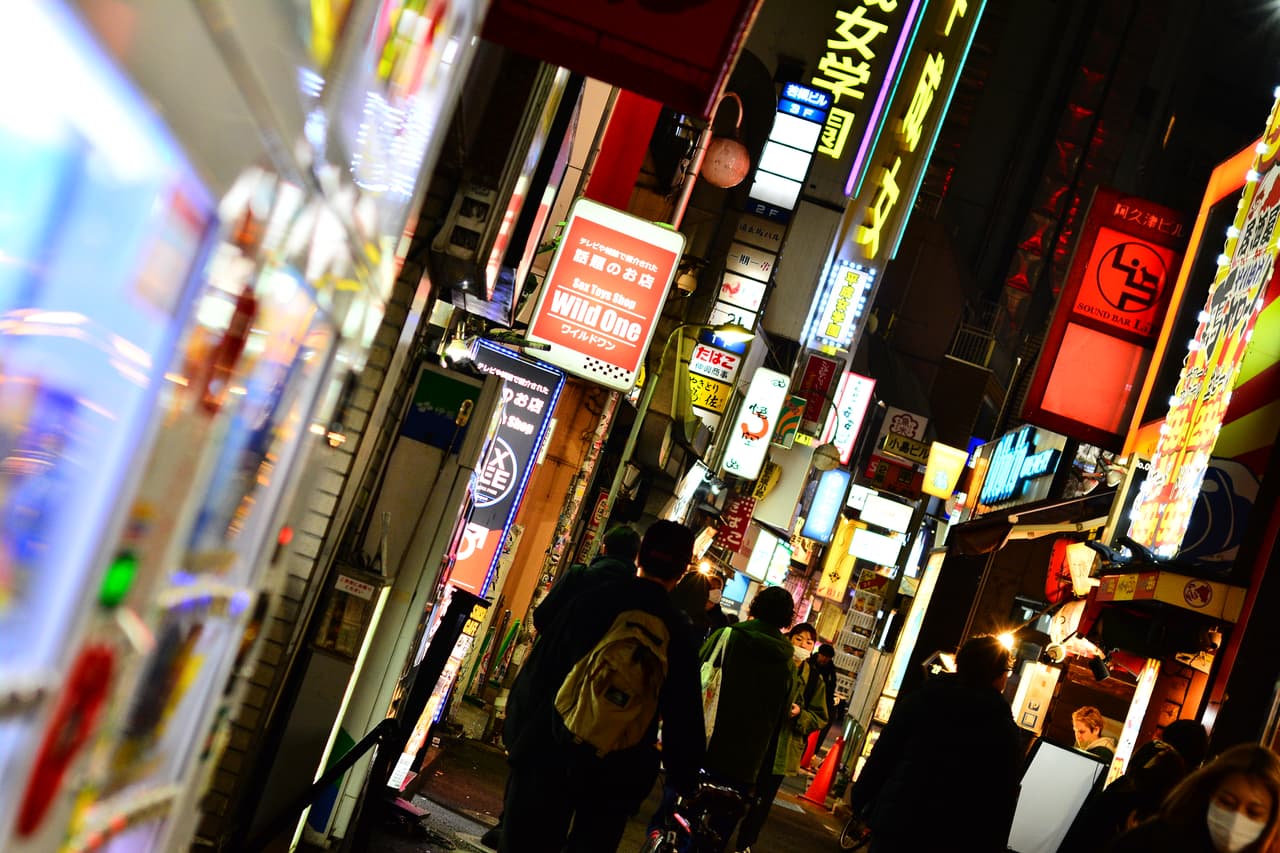 A neon-signed side street in Dōgenzaka, Shibuya — the heart of Tokyo's club district