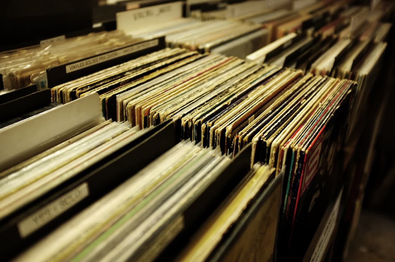 Crates of vinyl records at a store β the house labels worth digging for